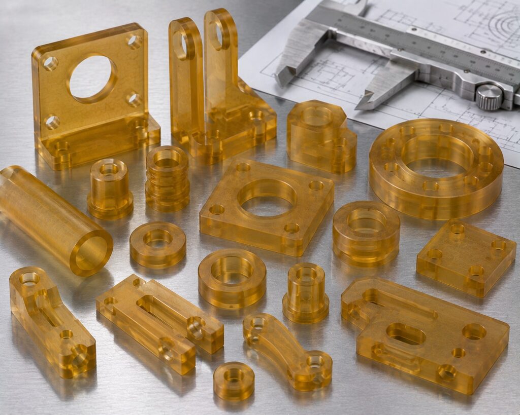 CNC machined ULTEM PEI components with drilled holes slots and precision features