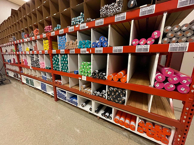 Plastic sheets, rods, and tubes stocked in Modern Plastics' warehouse, ready for shipment.
